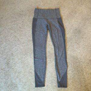 Lululemon size 6 gray leggings with side pockets and sheer panels